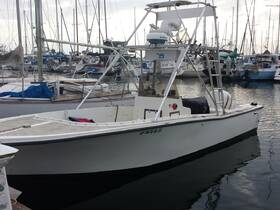 A sleek speedboat docked at the marina, showcasing its clean lines and ready-for-adventure design.