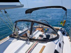 A detailed view of the helm area inside a sailboat, showcasing the console and navigation equipment, perfect for sailing enthusiasts.