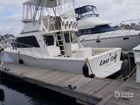 A sleek yacht named 'Last Cast' docked at the marina, showcasing its elegant design and spacious layout, perfect for fishing trips or leisurely cruises.