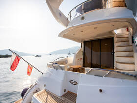 A stunning view of a yacht's exterior, showcasing its elegant design and inviting deck space, perfect for a day on the water.