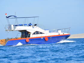 A vibrant yacht named 'Drafter' cruising through clear waters, showcasing its sleek design and perfect for adventurous outings on the sea.