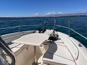 Interior view of a boat's seating area, featuring a clean and spacious layout ideal for relaxation and socializing while on the water.