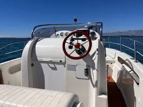 A well-equipped helm area of a boat showcasing the steering console and seating, perfect for navigating the open waters.