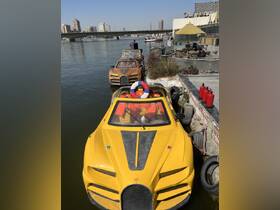Unique yellow boats docked along the river, showcasing a blend of style and functionality — perfect for leisurely rides in the city.