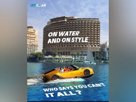 A stylish group enjoys a thrilling ride on a unique watercraft, showcasing the vibrant city skyline in the background — perfect for adventurous outings on the water.