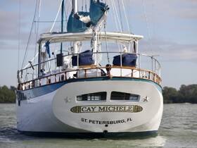 A stunning view of the 'Cay Michele' yacht docked, showcasing its elegant design and craftsmanship, perfect for luxury sailing experiences.