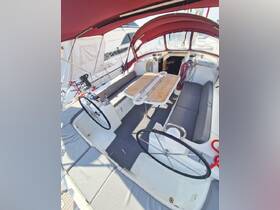 An inviting interior view of a boat's helm and seating area, showcasing comfortable seating and navigation controls, perfect for relaxing or planning your next adventure on the water.