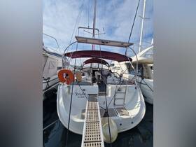 The interior of a well-equipped sailboat, showcasing the helm and seating area, perfect for comfortable cruising and relaxation on the water.