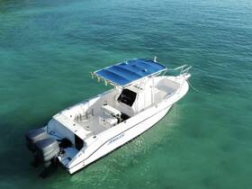 Aerial view of a sleek speedboat anchored in clear turquoise waters, showcasing its modern design and perfect for thrilling water adventures.