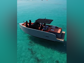 A group enjoys a relaxing day on a stylish boat in crystal-clear turquoise waters, perfect for summer outings and adventures.