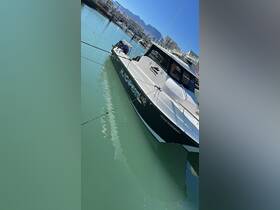 A sleek yacht named 'Black Pearl' docked in calm waters, showcasing its elegant design and surroundings.