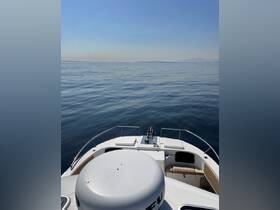 A serene view from the front of a boat, showcasing calm waters and a clear sky — perfect for peaceful outings on the water.