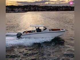 A couple enjoys a scenic ride on a sleek boat during sunset, showcasing the beauty of the water and the thrill of boating adventures.