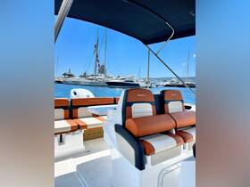 A stylish interior view of a Karnic boat showcasing comfortable seating and a well-designed helm, perfect for enjoying a day on the water.