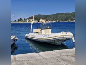 A sleek speedboat docked in calm waters, showcasing its elegant design against a picturesque coastal backdrop.