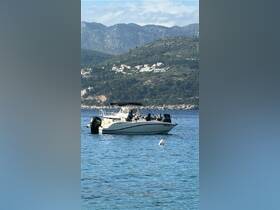 A group enjoys a day on the water aboard a boat, surrounded by stunning coastal scenery — perfect for memorable outings and adventures.