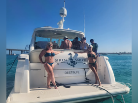 A lively group enjoys a day on the water aboard the 'Siren Sailor' in Destin, FL, showcasing fun and camaraderie under the sun.