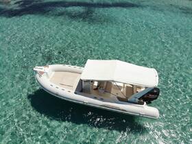 Aerial view of a sleek speedboat gliding over crystal-clear waters, perfect for exploring coastal destinations or enjoying a day on the water.