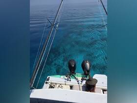 A serene moment on a fishing boat with clear turquoise waters below, showcasing the perfect setting for a day of fishing and relaxation.