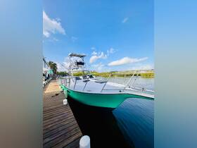 A sleek speedboat docked at a marina, showcasing its vibrant design against a clear blue sky — perfect for water adventures.
