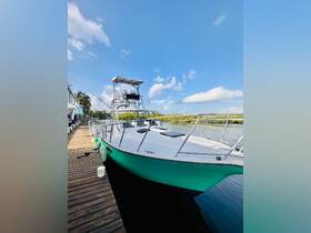 A striking view of a boat docked at the marina, showcasing its sleek design against a clear blue sky — perfect for water adventures.