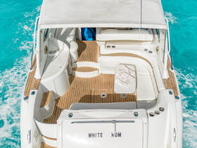 An inviting view of the interior seating area of the 'White Kum' boat, showcasing its stylish design and comfortable layout, perfect for relaxing on the water.