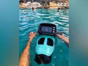 A group enjoys snorkeling in crystal-clear turquoise waters, showcasing the excitement of underwater exploration and fun in the sun.