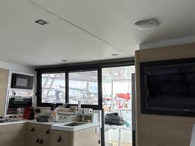 Interior view of a modern boat kitchen area, showcasing sleek cabinetry and appliances, perfect for onboard dining and entertainment.