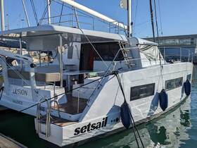 A sleek yacht named 'Set Sail' docked at the marina, showcasing its modern design and spacious layout, perfect for luxury cruising.