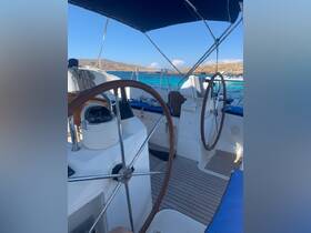 An inviting view of the helm area inside a boat, showcasing the steering wheels and navigation equipment, perfect for a day of sailing on clear blue waters.