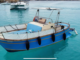 A vibrant blue boat anchored in clear turquoise waters, showcasing its structure and design — perfect for leisurely outings or fishing trips.