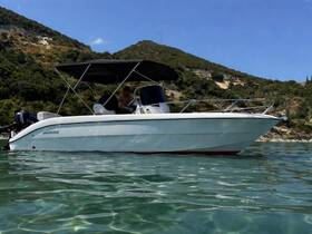 A sleek speedboat glides through clear waters, showcasing its stylish design and perfect for a day of adventure on the water.