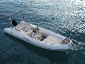 A sleek speedboat floats gracefully on calm waters, showcasing its modern design and inviting features — perfect for a day of adventure on the sea.