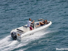A couple enjoys a thrilling ride on a speedboat, capturing the essence of fun and adventure on the water.
