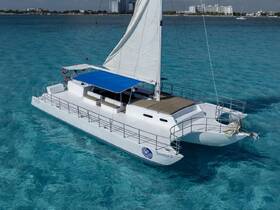 A stunning aerial view of the Samba 3 catamaran gliding through crystal-clear waters, perfect for luxurious sailing adventures.