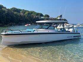 A sleek yacht rests on the sandy shore, showcasing its modern design and inviting atmosphere — perfect for luxury outings on the water.