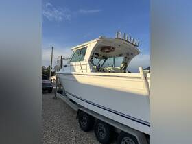 A side view of a well-equipped boat on a trailer, showcasing its sleek design and features — perfect for fishing or leisure outings.