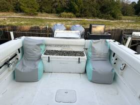 A cozy interior view of a boat featuring comfortable seating options, perfect for relaxing while out on the water.