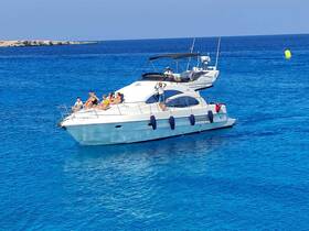 A lively group enjoys a day on a yacht, soaking up the sun and taking in the beautiful turquoise waters — perfect for summer adventures.