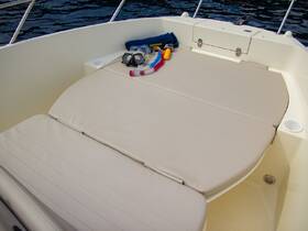 An inviting setup featuring snorkel gear and a towel on the deck of a boat, perfect for a day of water activities and relaxation.
