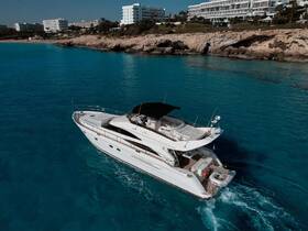 A stunning aerial view of a luxurious yacht cruising through crystal-clear waters, perfect for showcasing upscale boating experiences.