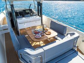 A beautifully arranged dining area on a boat featuring an array of delicious food and drinks, perfect for enjoying a meal while cruising on the water.