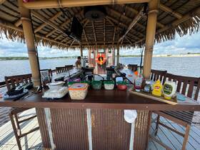 A well-equipped bar area with a variety of food options and condiments, perfect for entertaining guests on the water.
