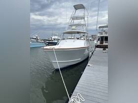 A pristine yacht docked at the marina, showcasing its sleek design and ready for a day on the water.