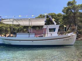A charming fishing boat docked in clear waters, showcasing its unique design and vibrant flags against a backdrop of lush greenery.