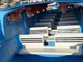 Interior view of a boat showcasing the seating arrangement, ideal for group outings or tours on the water.