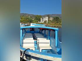 Interior view of a boat showcasing its seating arrangement, perfect for group outings or tours on the water.