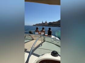 A group of friends enjoys a scenic boat ride with a stunning view of the city skyline, perfect for capturing memorable moments on the water.