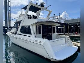 A sleek yacht docked at the marina, showcasing its elegant design and spacious deck — perfect for luxury charters and private events.