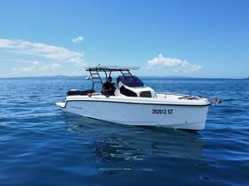 A sleek speedboat named 'Protagon' glides through calm waters, showcasing its modern design and inviting atmosphere for a day on the sea.